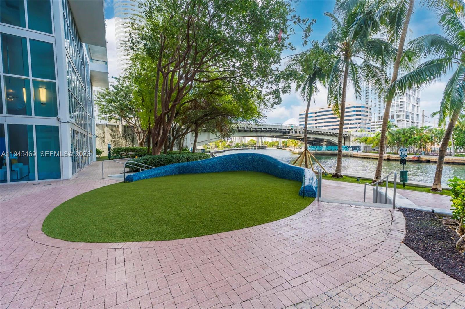185 Southwest 7th Street, Unit 3508 Miami, FL 33130 - Photo 51 of 62 a view of a swimming pool with a garden