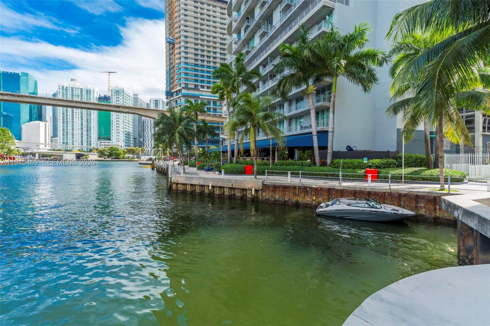 185 Southwest 7th Street, Unit 3508 Miami, FL 33130 - Photo 55 of 62 a view of swimming pool with outdoor seating and lake view