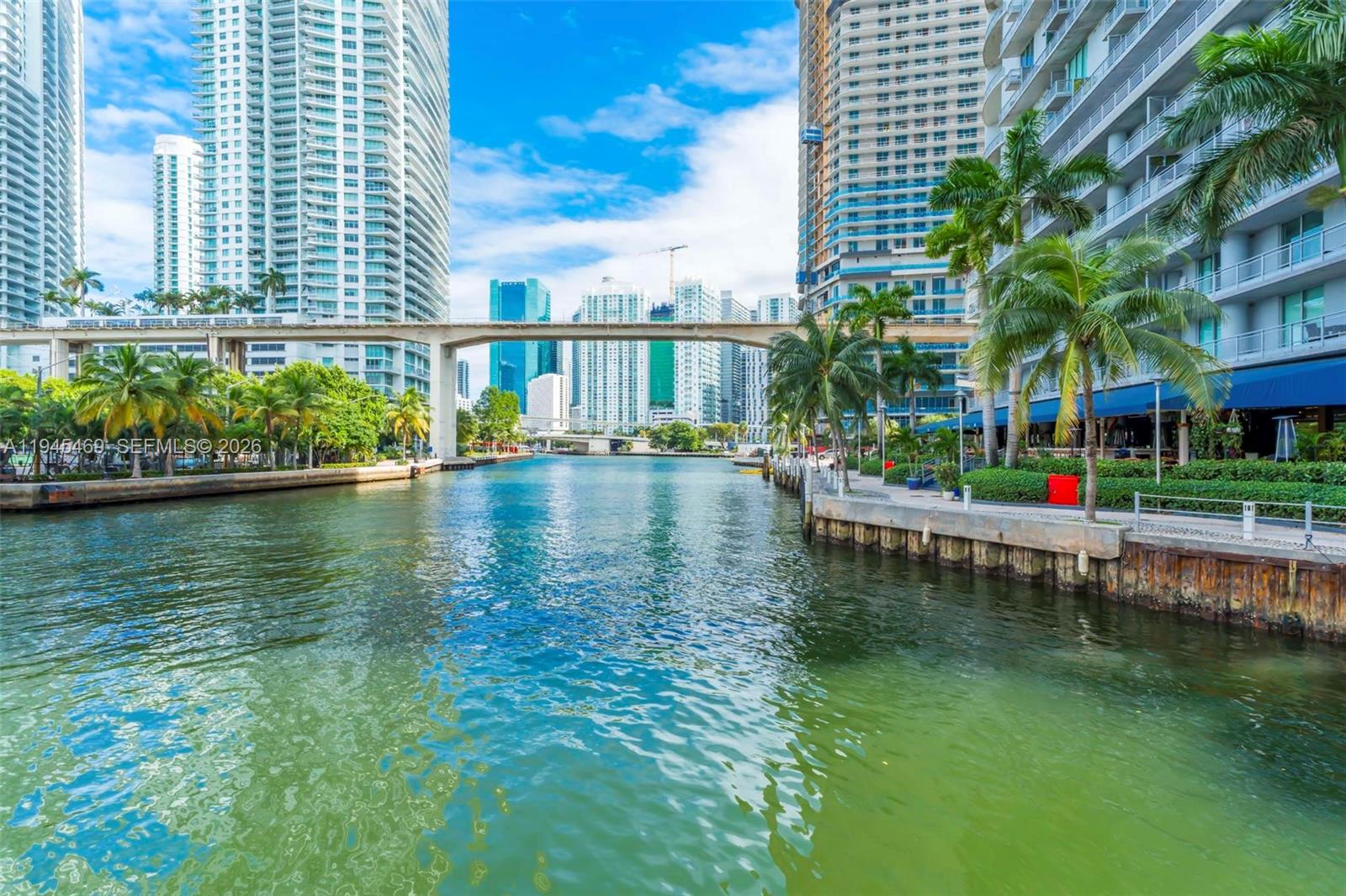 185 Southwest 7th Street, Unit 3508 Miami, FL 33130 - Photo 56 of 62 a view of swimming pool with outdoor seating and lake