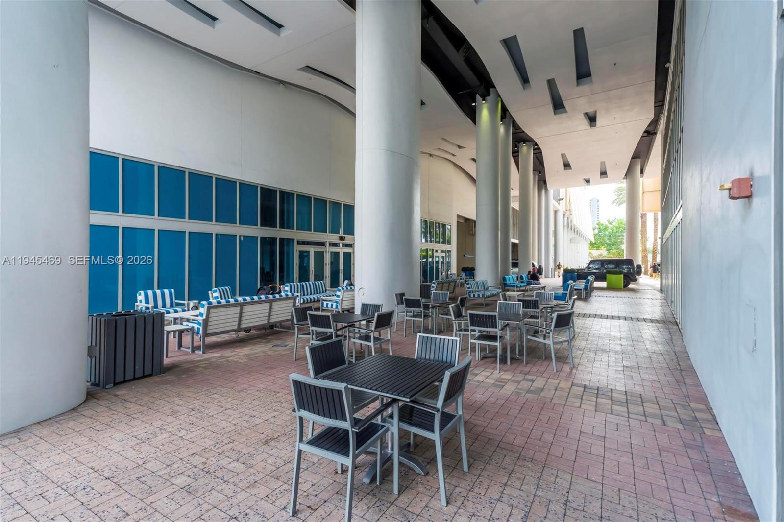 185 Southwest 7th Street, Unit 3508 Miami, FL 33130 - Photo 58 of 62 an outdoor space with lots of tables and chairs