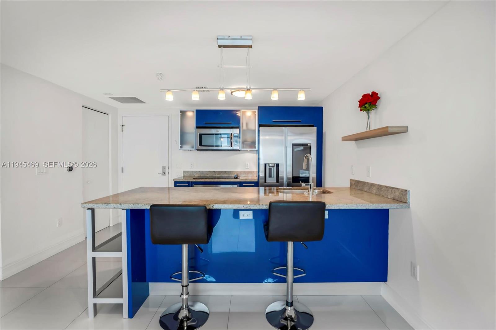 185 Southwest 7th Street, Unit 3508 Miami, FL 33130 - Photo 7 of 62 a kitchen with a sink cabinets and window