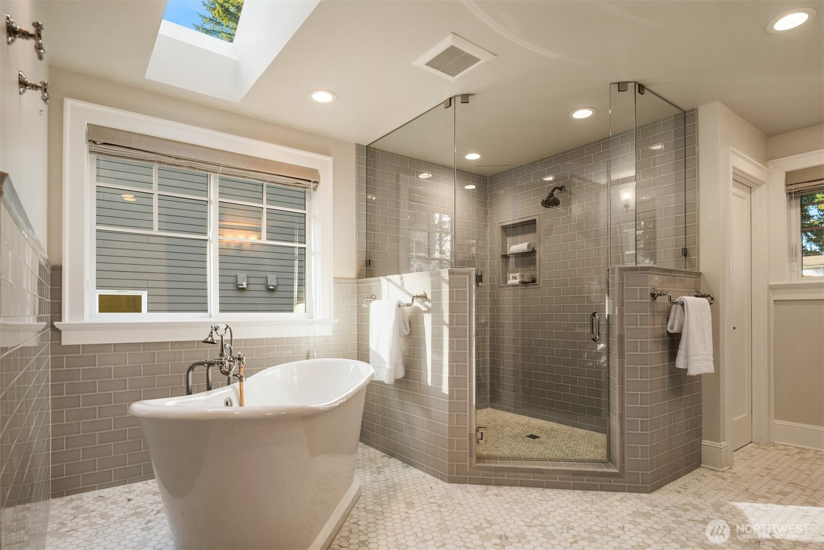 10475 Southeast 23rd Street Bellevue, WA 98004 - Photo 14 of 35 a bathroom with a bathtub and a shower