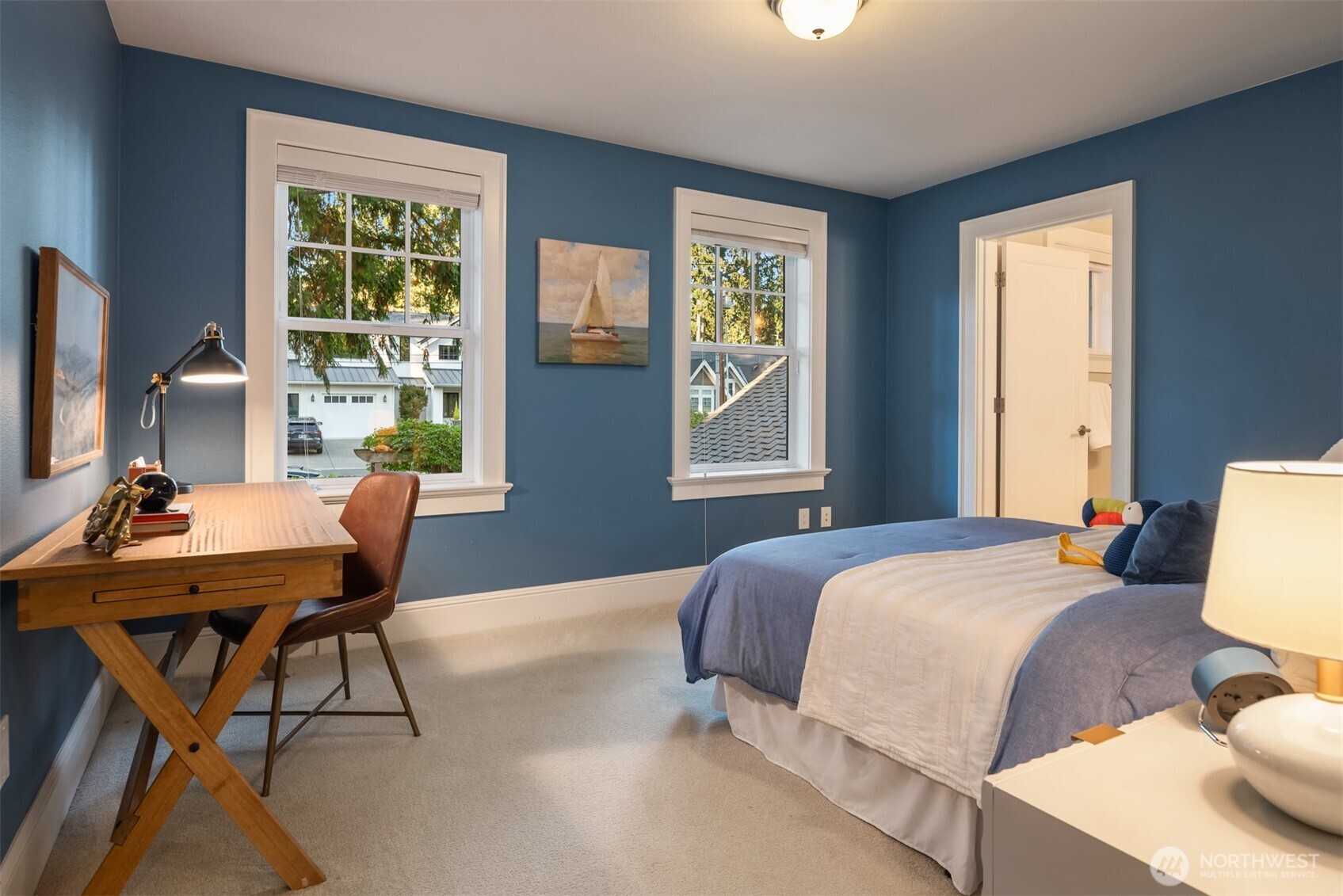 10475 Southeast 23rd Street Bellevue, WA 98004 - Photo 17 of 35 a bedroom with a bed and a table