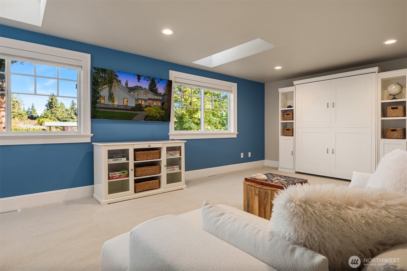 10475 Southeast 23rd Street Bellevue, WA 98004 - Photo 21 of 35 a living room with furniture and a flat screen tv