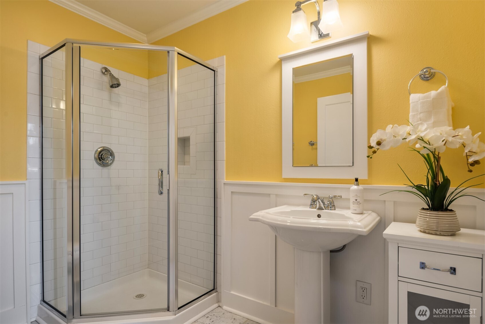 10475 Southeast 23rd Street Bellevue, WA 98004 - Photo 23 of 35 a bathroom with a shower sink and mirror