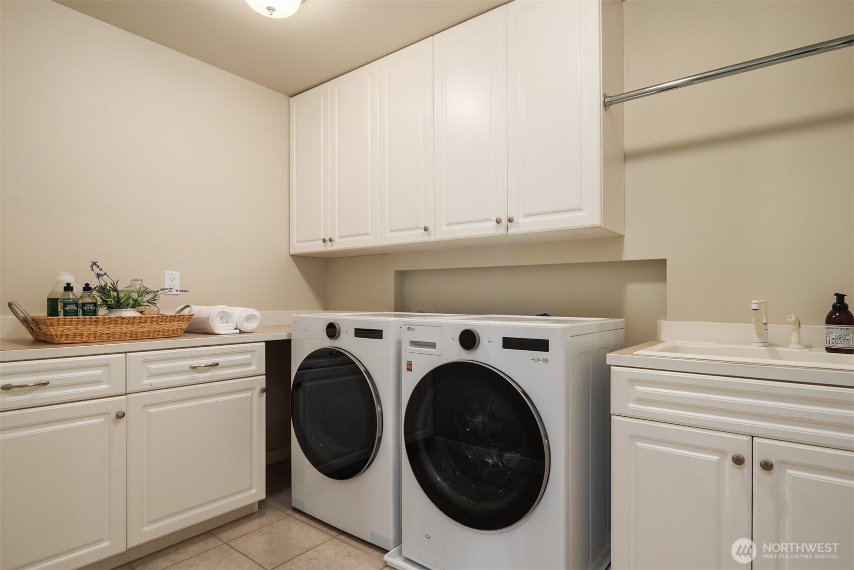 10475 Southeast 23rd Street Bellevue, WA 98004 - Photo 24 of 35 a utility room with sink dryer and washer