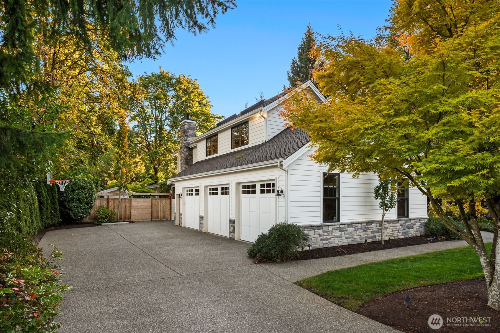 10475 Southeast 23rd Street Bellevue, WA 98004 - Photo 26 of 35 a front view of a house with a garden and trees