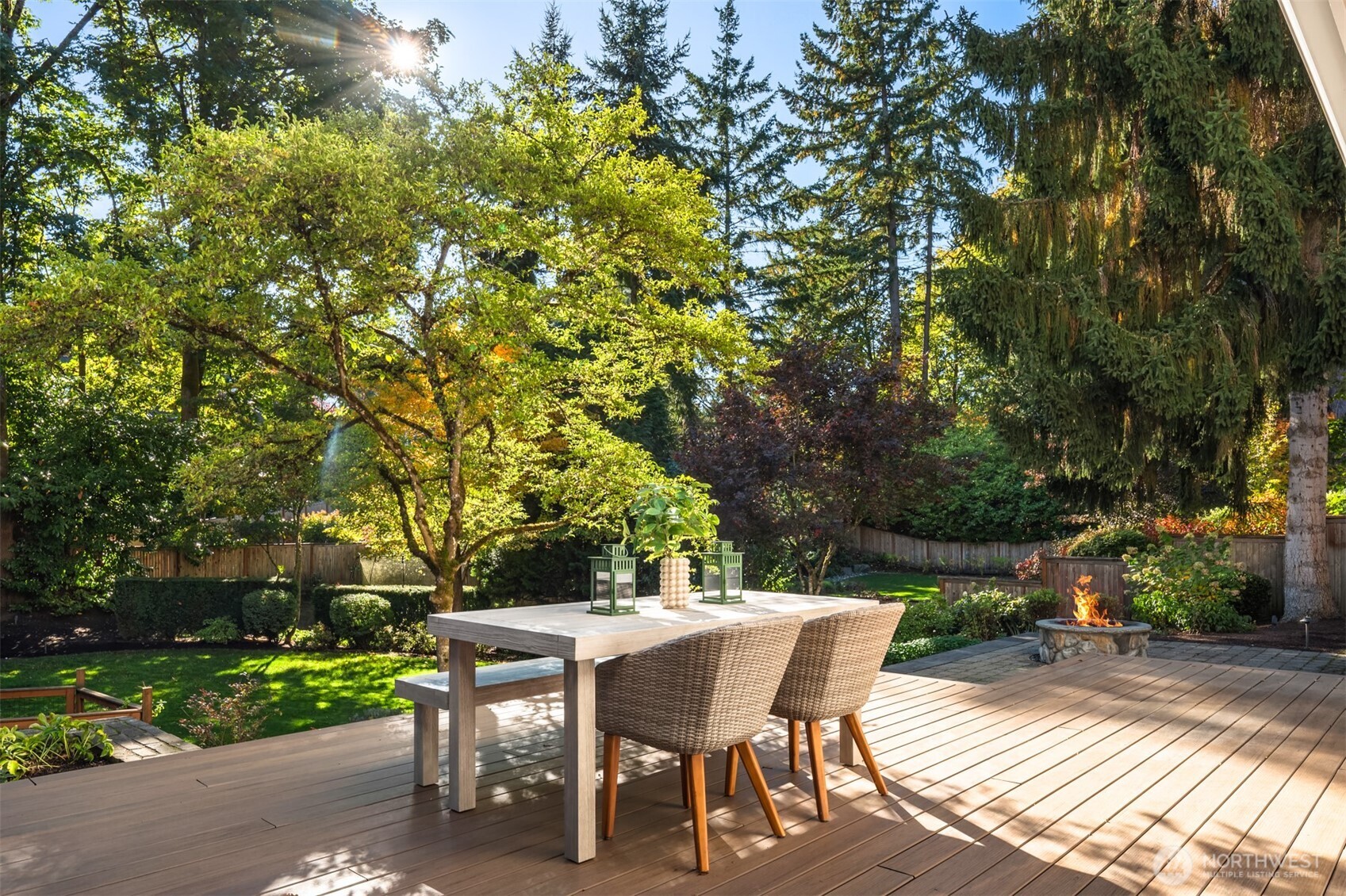 10475 Southeast 23rd Street Bellevue, WA 98004 - Photo 30 of 35 a view of a patio with table and chairs and potted plants