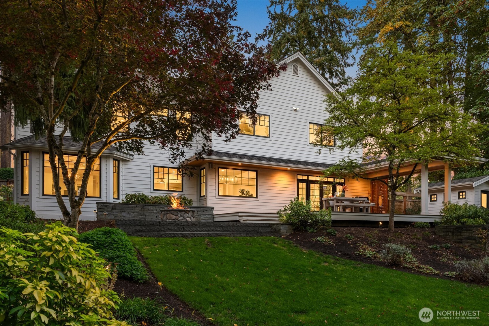 10475 Southeast 23rd Street Bellevue, WA 98004 - Photo 32 of 35 a front view of a house with a yard and trees