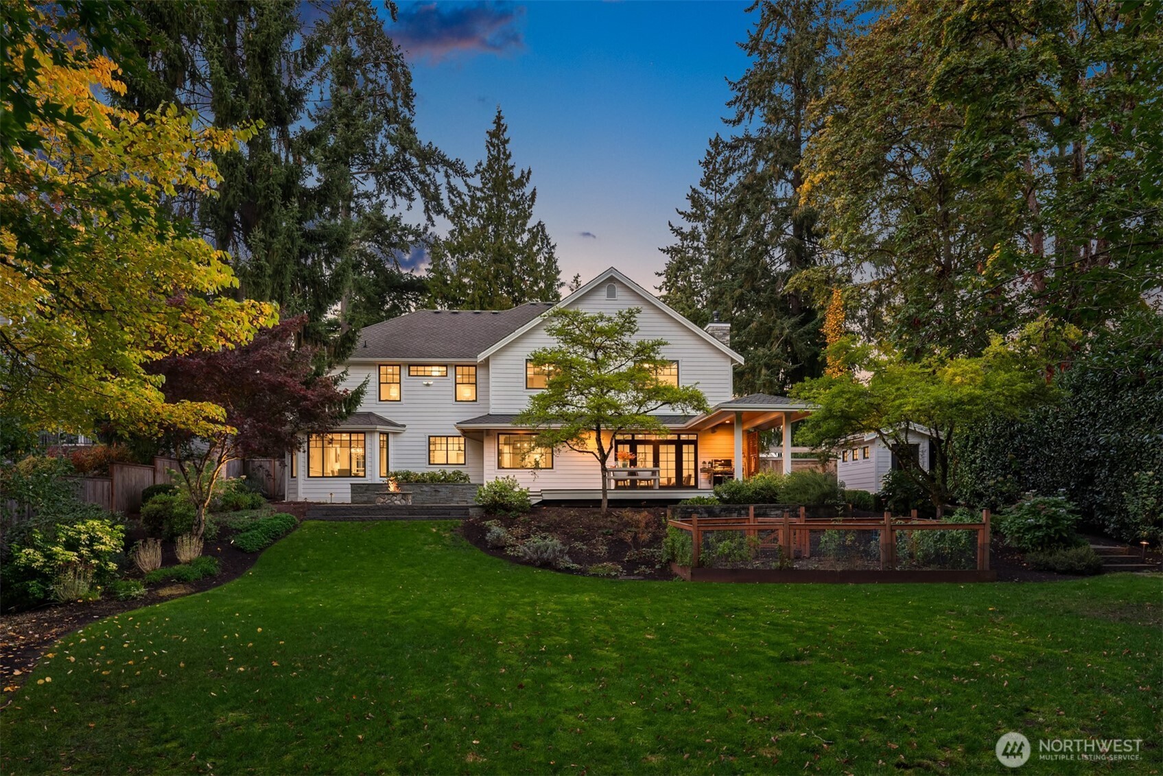 10475 Southeast 23rd Street Bellevue, WA 98004 - Photo 34 of 35 a view of a house next to a big yard and large trees