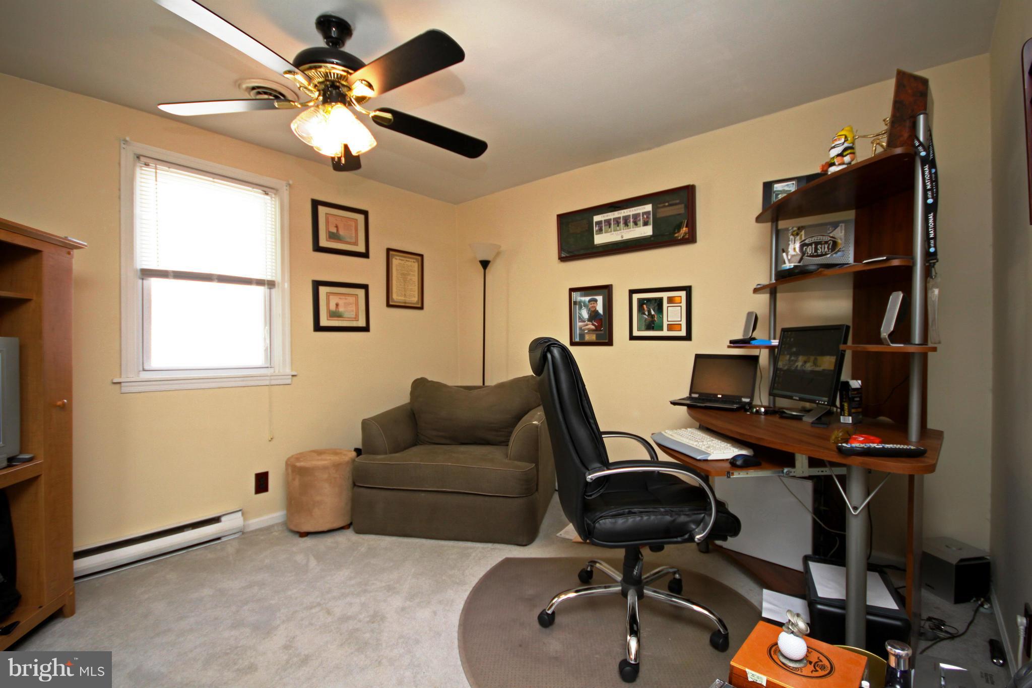 364 Nicholson Road Baltimore, MD 21221 - Photo 2 of 30 a view of a workspace with furniture and a window