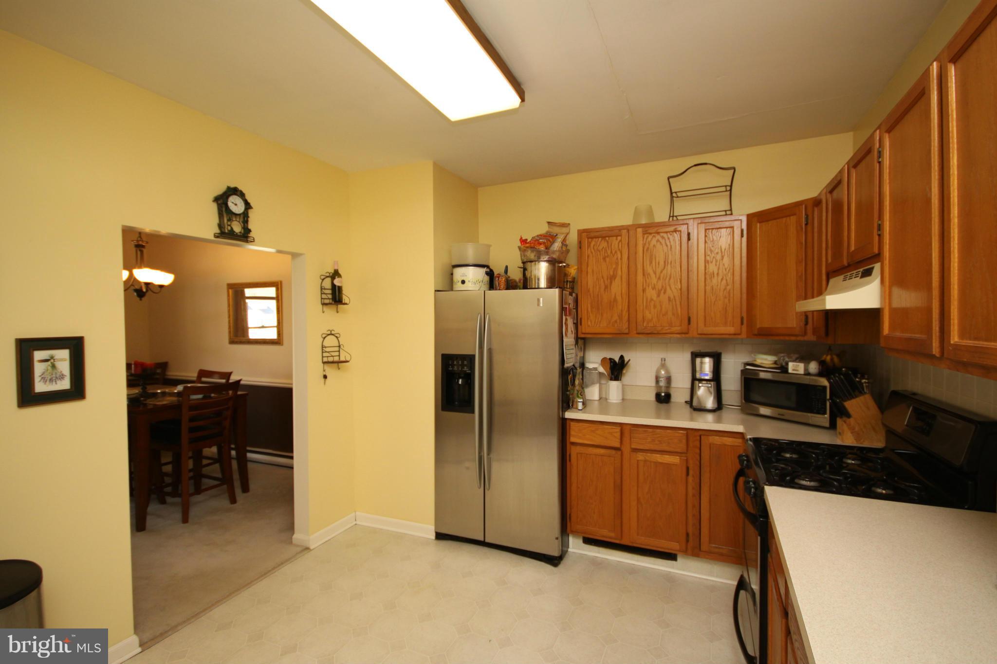 364 Nicholson Road Baltimore, MD 21221 - Photo 14 of 30 a kitchen with a refrigerator and a sink
