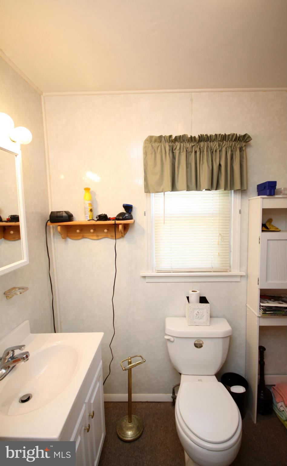 364 Nicholson Road Baltimore, MD 21221 - Photo 15 of 30 a bathroom with a toilet and a sink