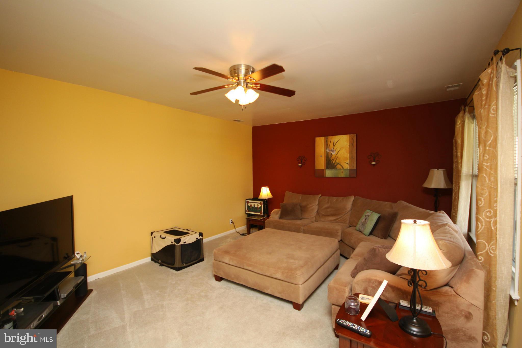 364 Nicholson Road Baltimore, MD 21221 - Photo 16 of 30 a bedroom with a bed and a chandelier