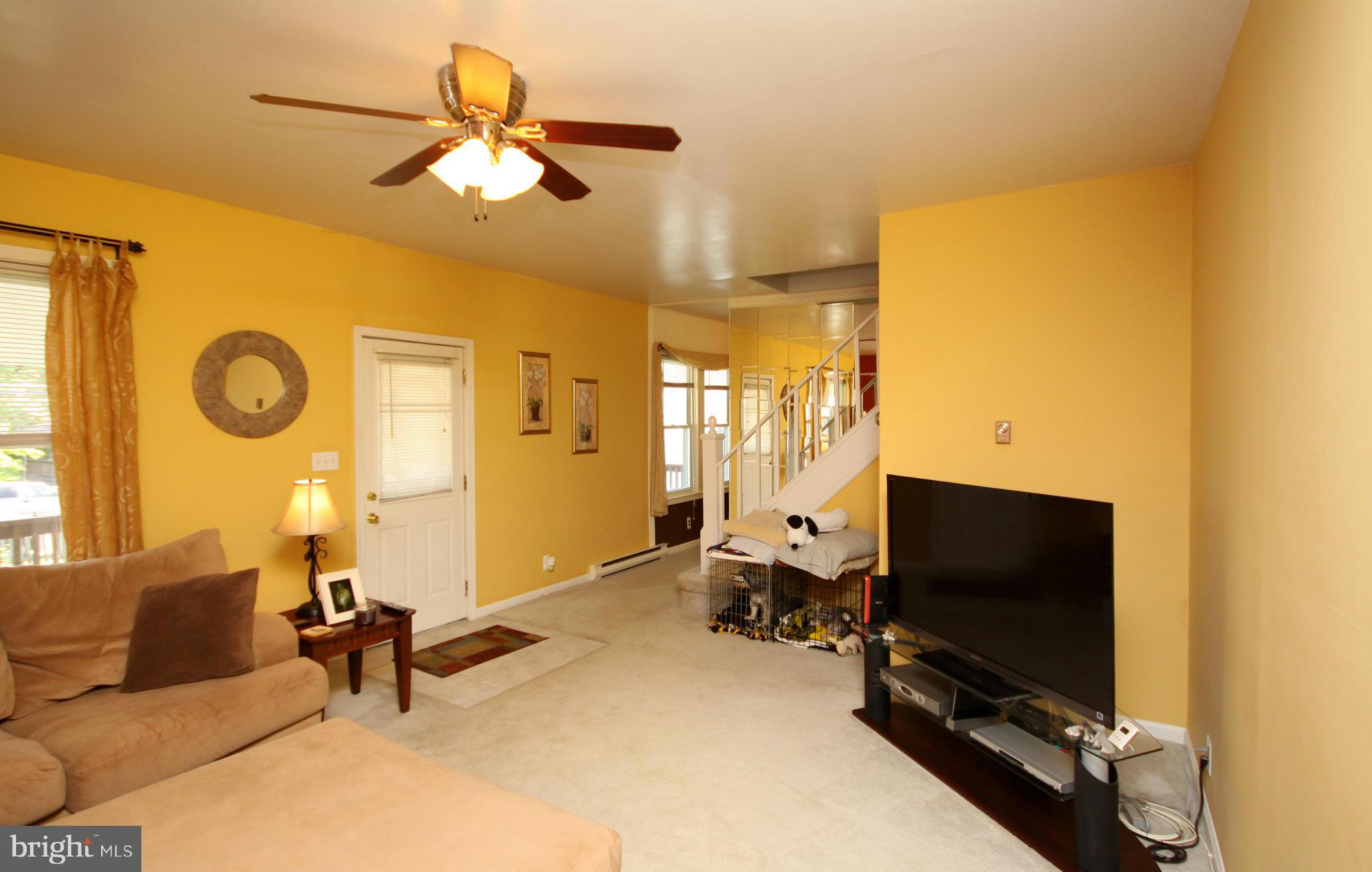 364 Nicholson Road Baltimore, MD 21221 - Photo 17 of 30 a view of a livingroom with furniture and a flat screen tv