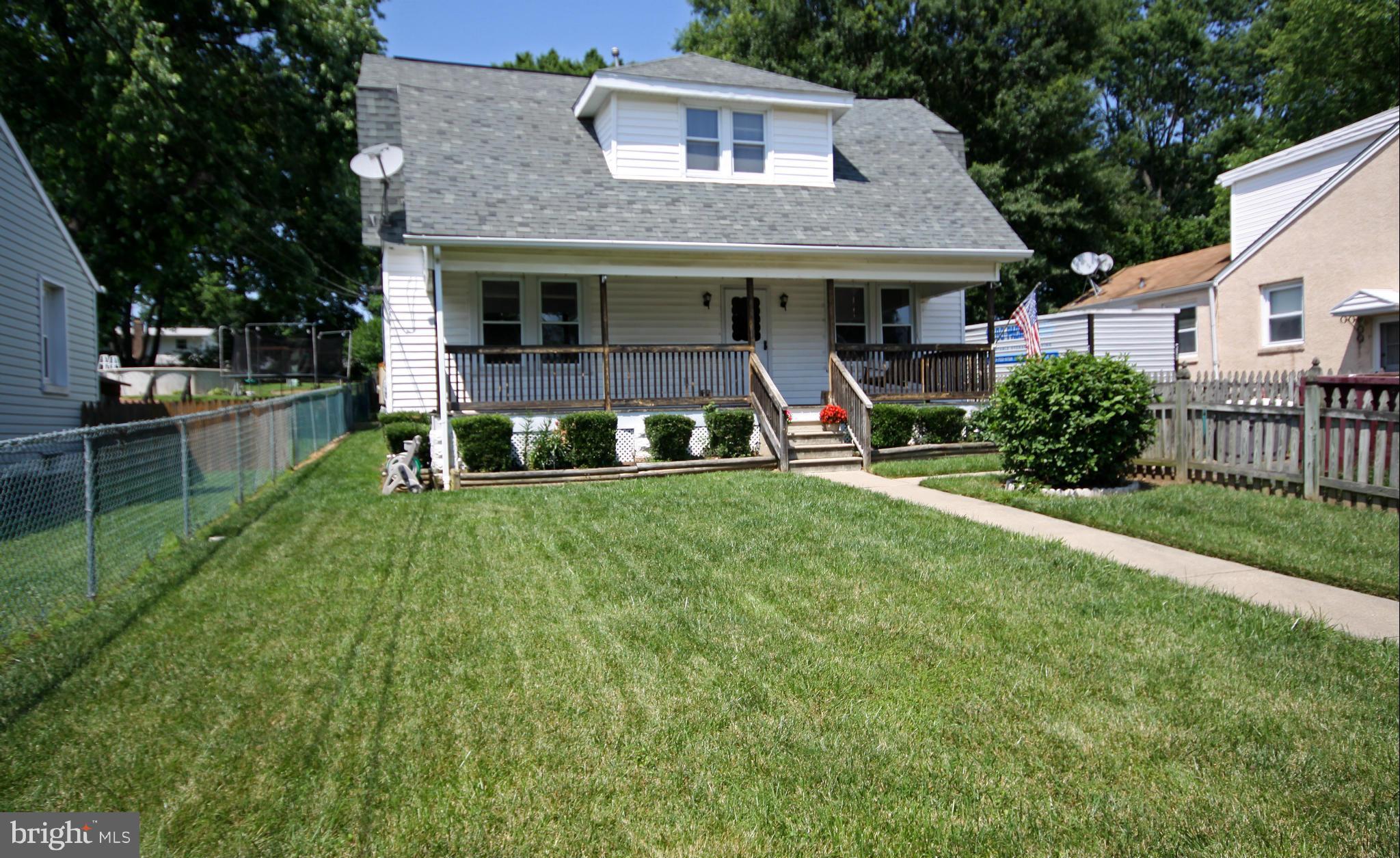 364 Nicholson Road Baltimore, MD 21221 - Photo 29 of 30 a front view of a house with a yard table and chairs