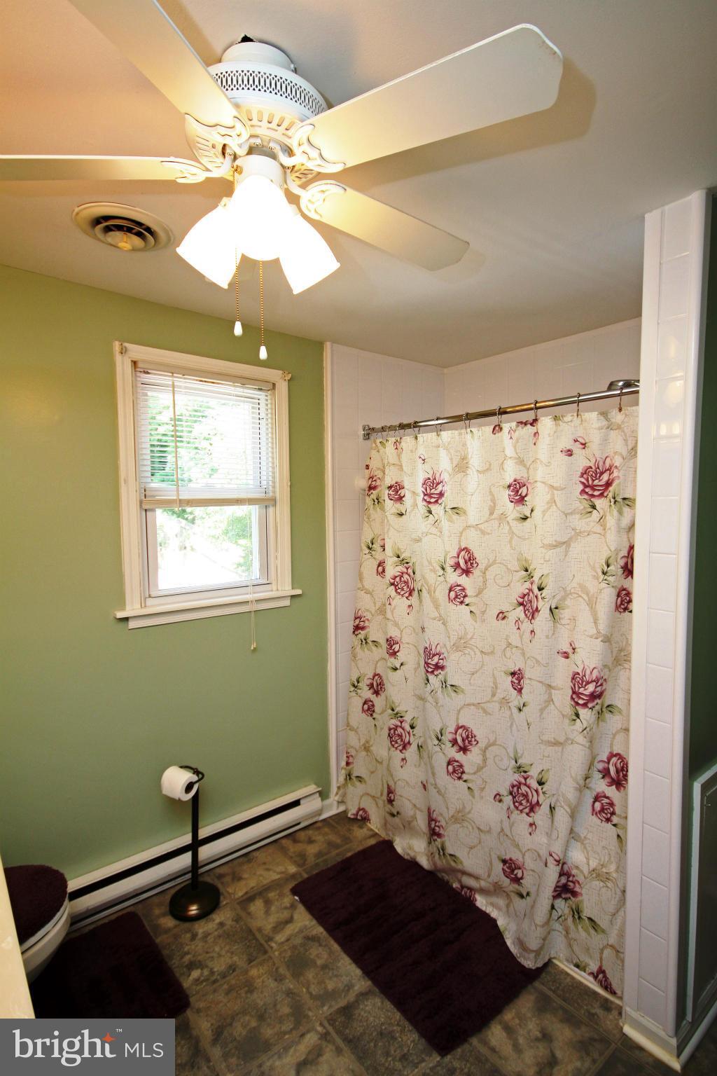 364 Nicholson Road Baltimore, MD 21221 - Photo 6 of 30 a view of a room with window and fan