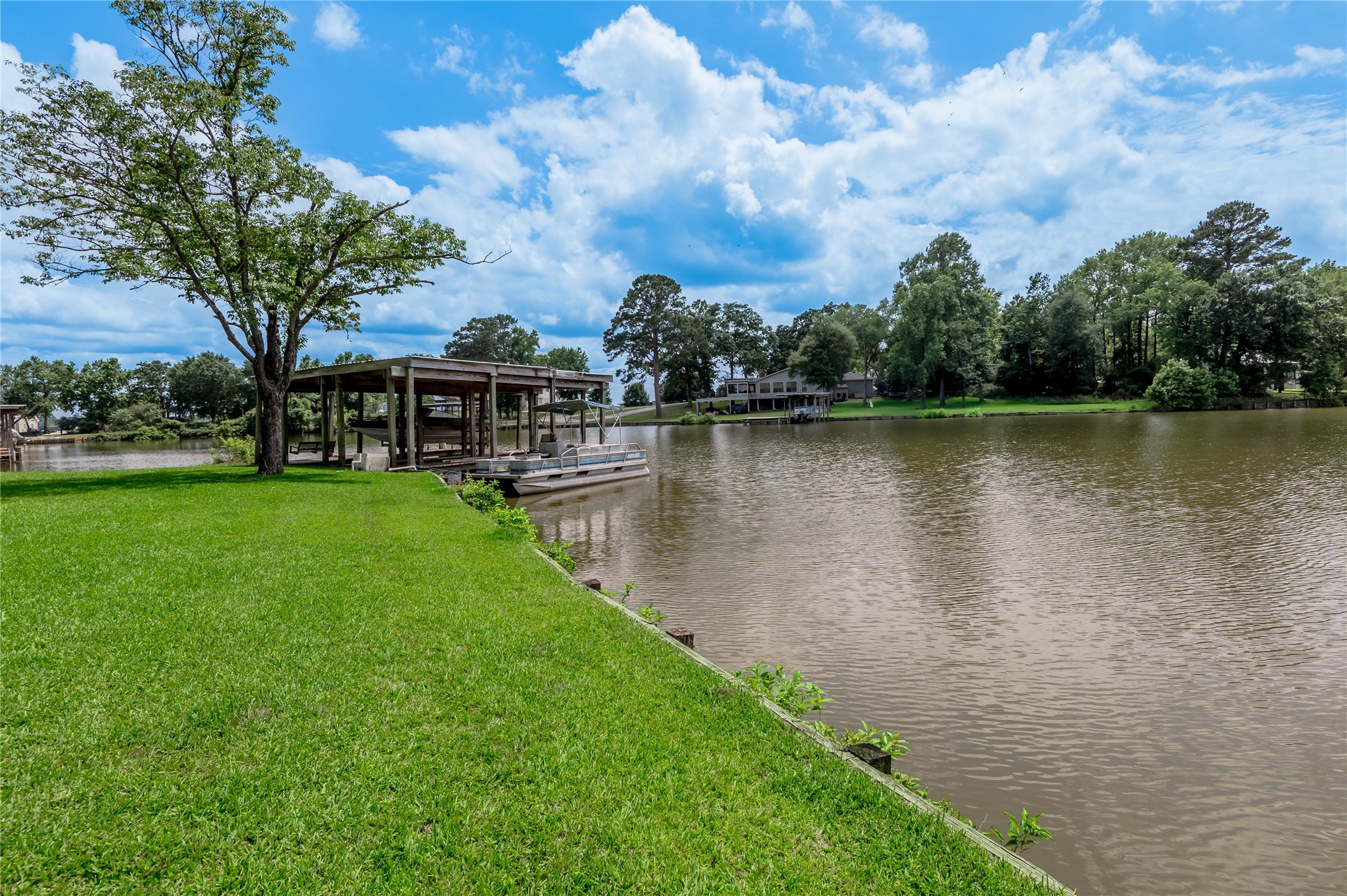 324 Red Oak Lane Trinity, TX 75862 - Photo 9 of 49 a view of a lake with houses in the back