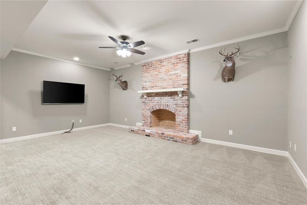 1450 Acworth Due West Road Northwest Kennesaw, GA 30152 - Photo 50 of 77 a living room with a flat screen tv and a fireplace