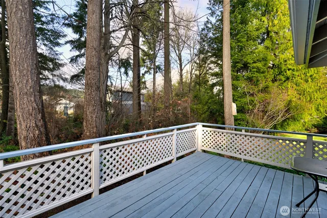 a view of a balcony with wooden floor
