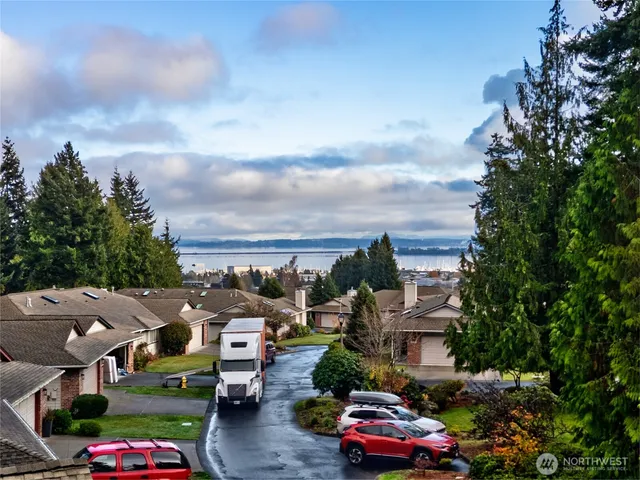 a city view with cars parked