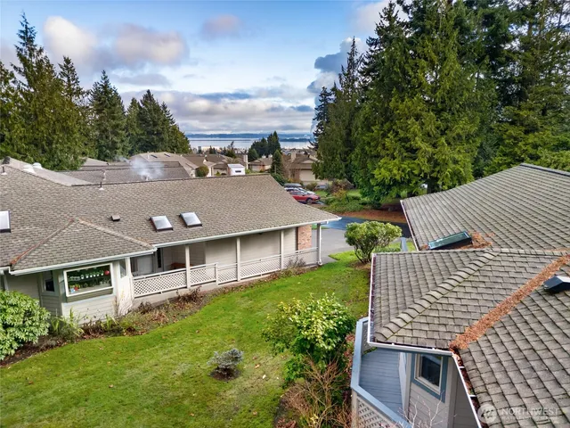 a aerial view of a house with a yard
