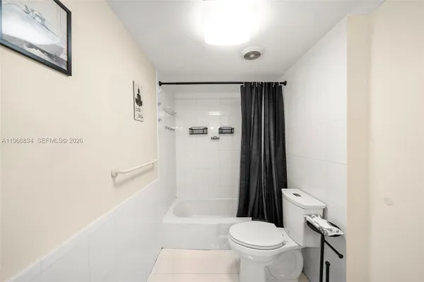 a bed room with a bed and a tv