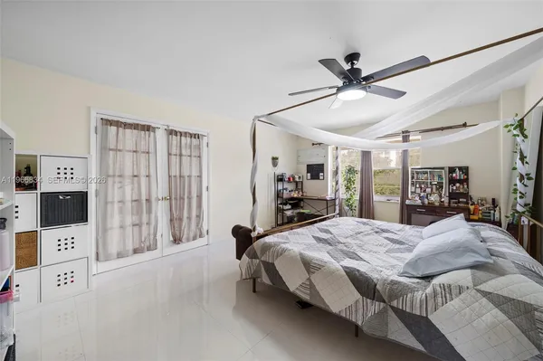 a bed room with a bed and a book shelf