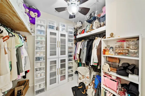 a bathroom with a sink vanity and mirror