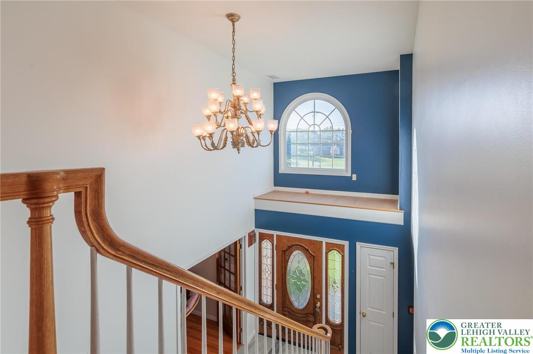 2170 Clearview Road Coplay, PA 18037 - Photo 33 of 75 This grand foyer showcases an impressive staircase and an arched window, creating an inviting entry.