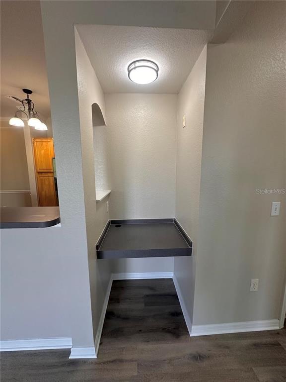 3280 Soho Street, Unit 307 Orlando, FL 32835 - Photo 10 of 34 a view of entryway and hall with wooden floor