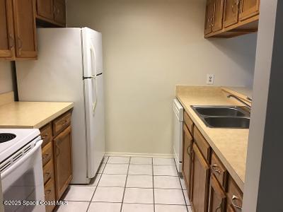935 Prosperity Place, Unit 803 Rockledge, FL 32955 - Photo 5 of 17 a utility room with dryer and washer