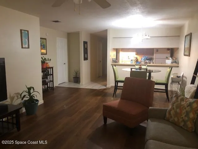 a view of a livingroom with furniture and wooden floor