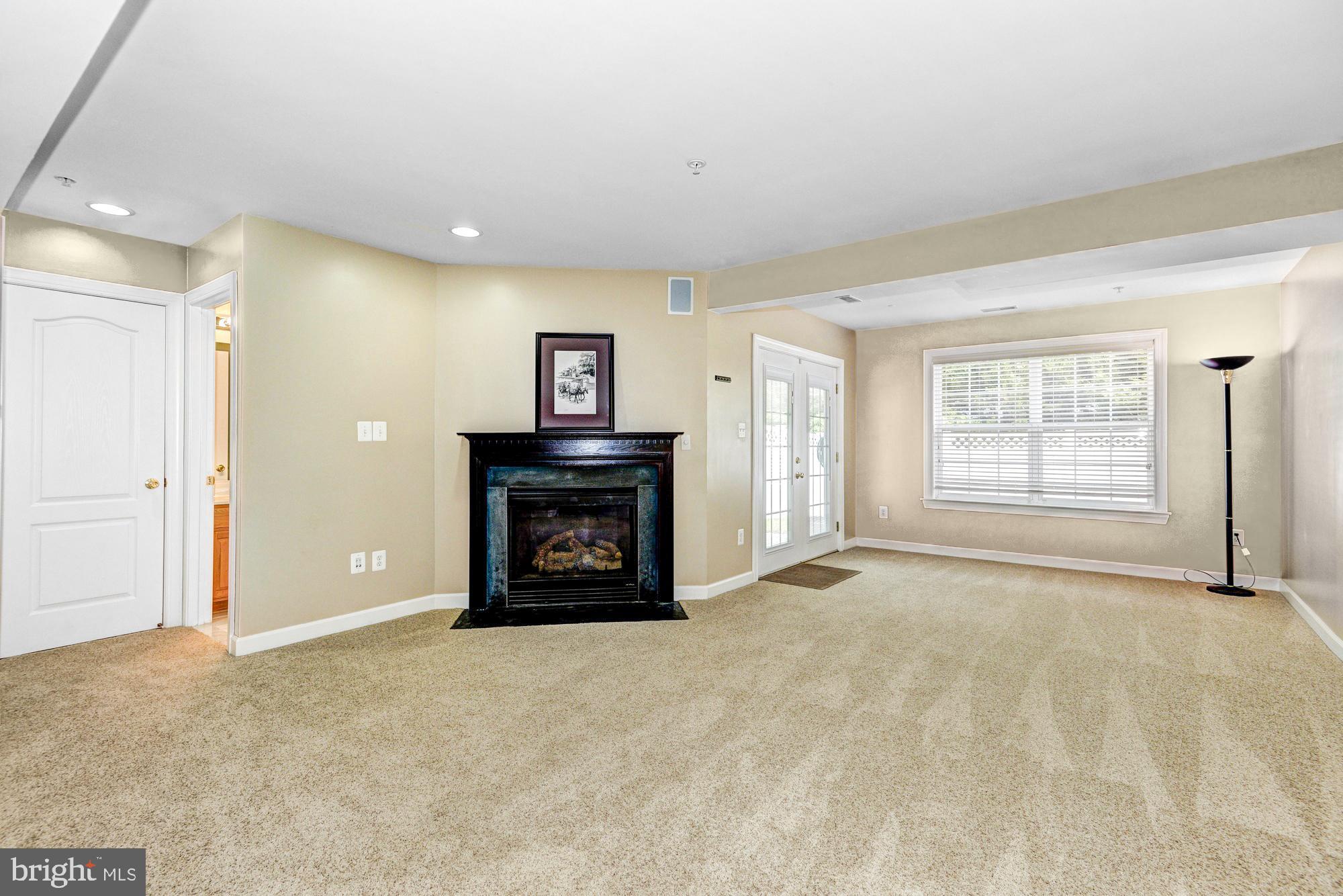 2312 Abby Road Edgewater, MD 21037 - Photo 21 of 38 Gas fireplace in finished basement