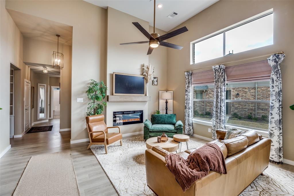 12420 Audubon Trail Rowlett, TX 75098 - Photo 2 of 27 Cozy Living Area with plenty of natural light and Electric Fireplace