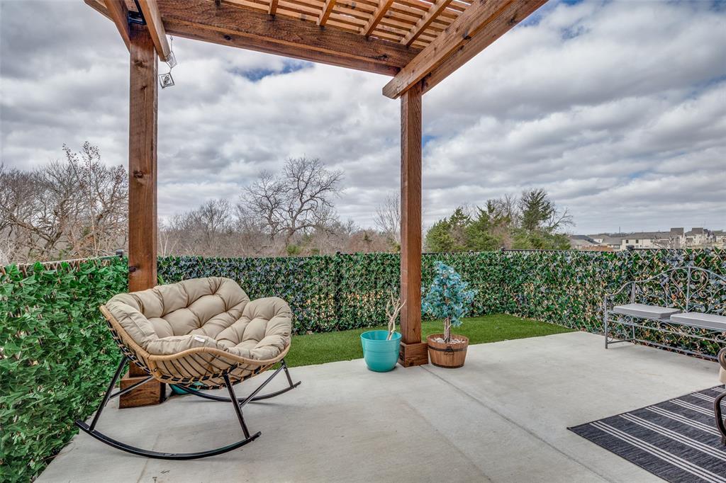 12420 Audubon Trail Rowlett, TX 75098 - Photo 24 of 27 Extended Patio with Turf and Added Pergola