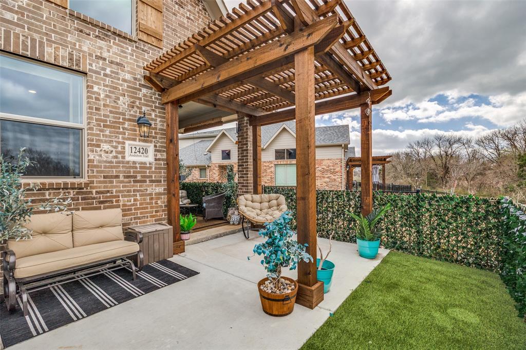 12420 Audubon Trail Rowlett, TX 75098 - Photo 26 of 27 View of Patio with Pergola and Turf