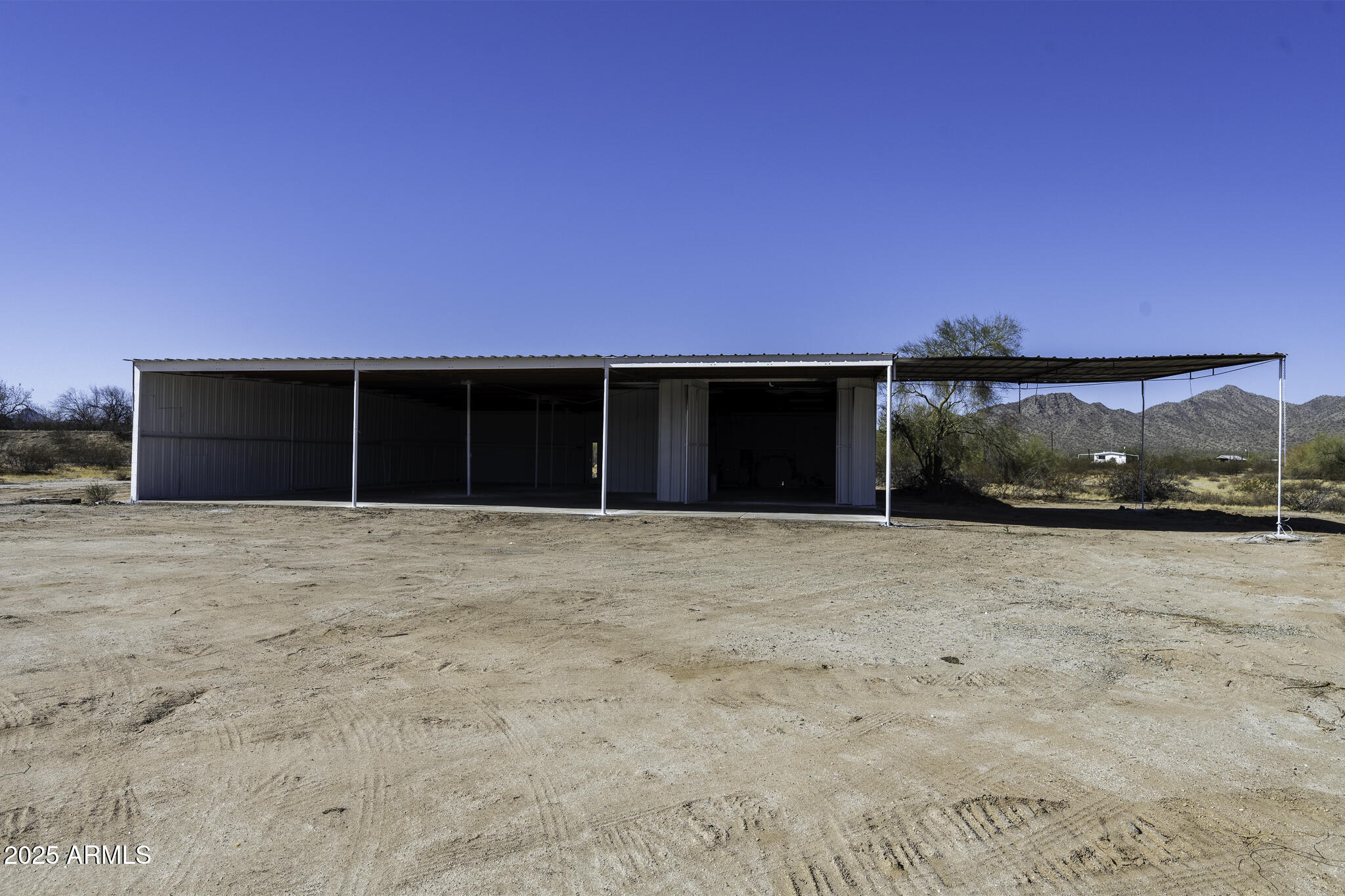 330 North Warren Road, Unit 50161001G Maricopa, AZ 85139 - Photo 11 of 39 a view of a house with a yard