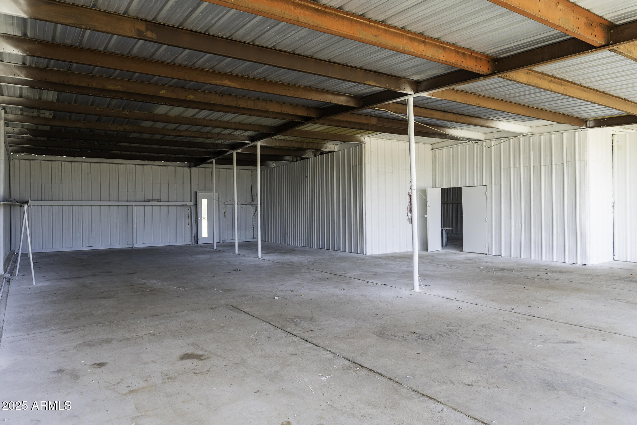 330 North Warren Road, Unit 50161001G Maricopa, AZ 85139 - Photo 15 of 39 a view of empty room with wooden walls