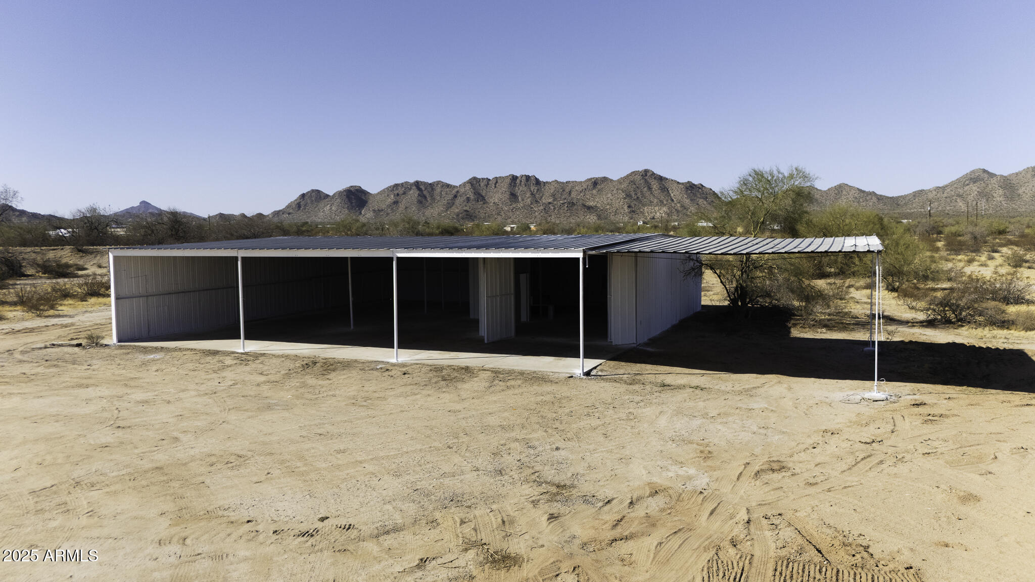 330 North Warren Road, Unit 50161001G Maricopa, AZ 85139 - Photo 19 of 39 a view of a house with a snow in the yard