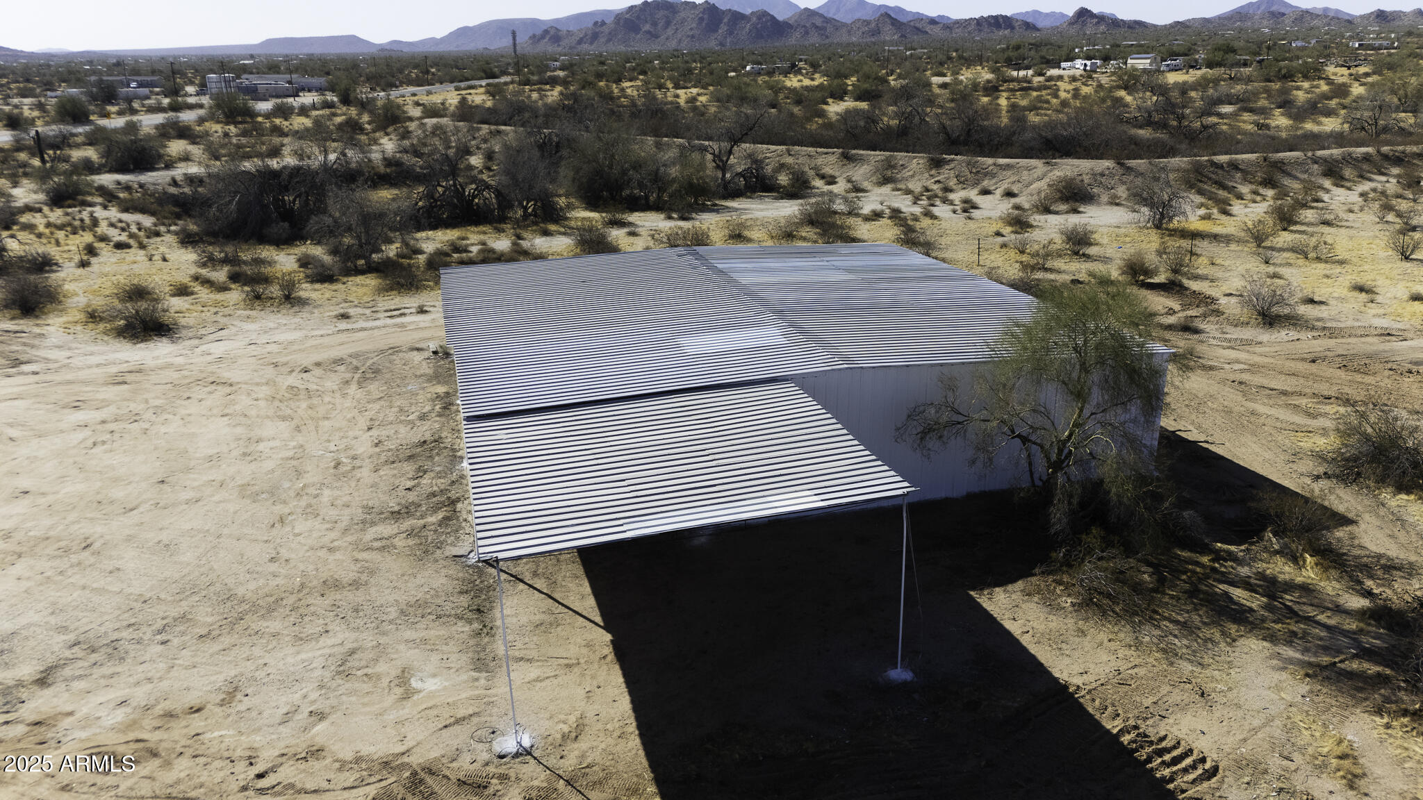 330 North Warren Road, Unit 50161001G Maricopa, AZ 85139 - Photo 20 of 39 an aerial view of residential houses with outdoor space