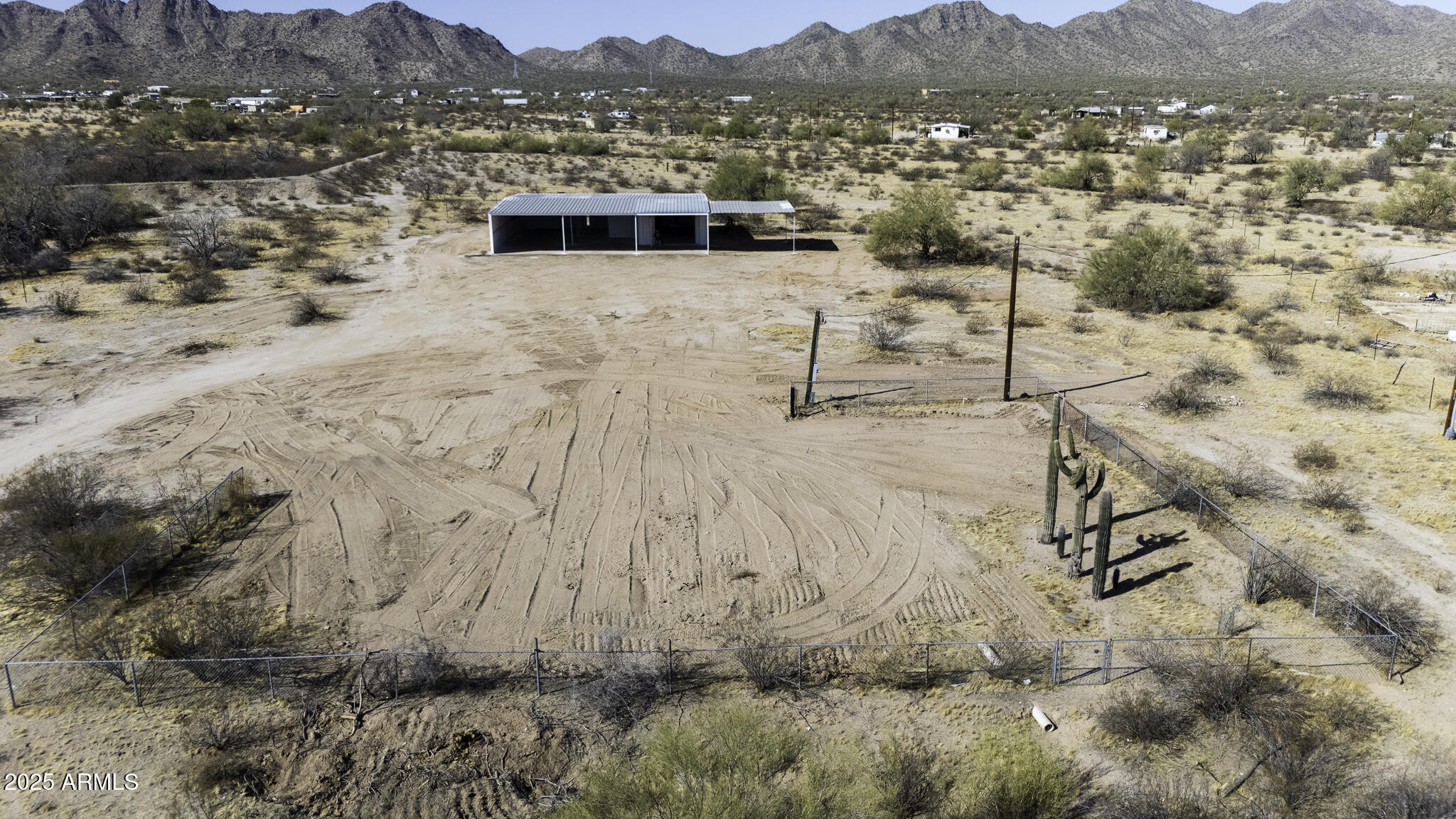 330 North Warren Road, Unit 50161001G Maricopa, AZ 85139 - Photo 27 of 39 a view of a terrace with a mountain