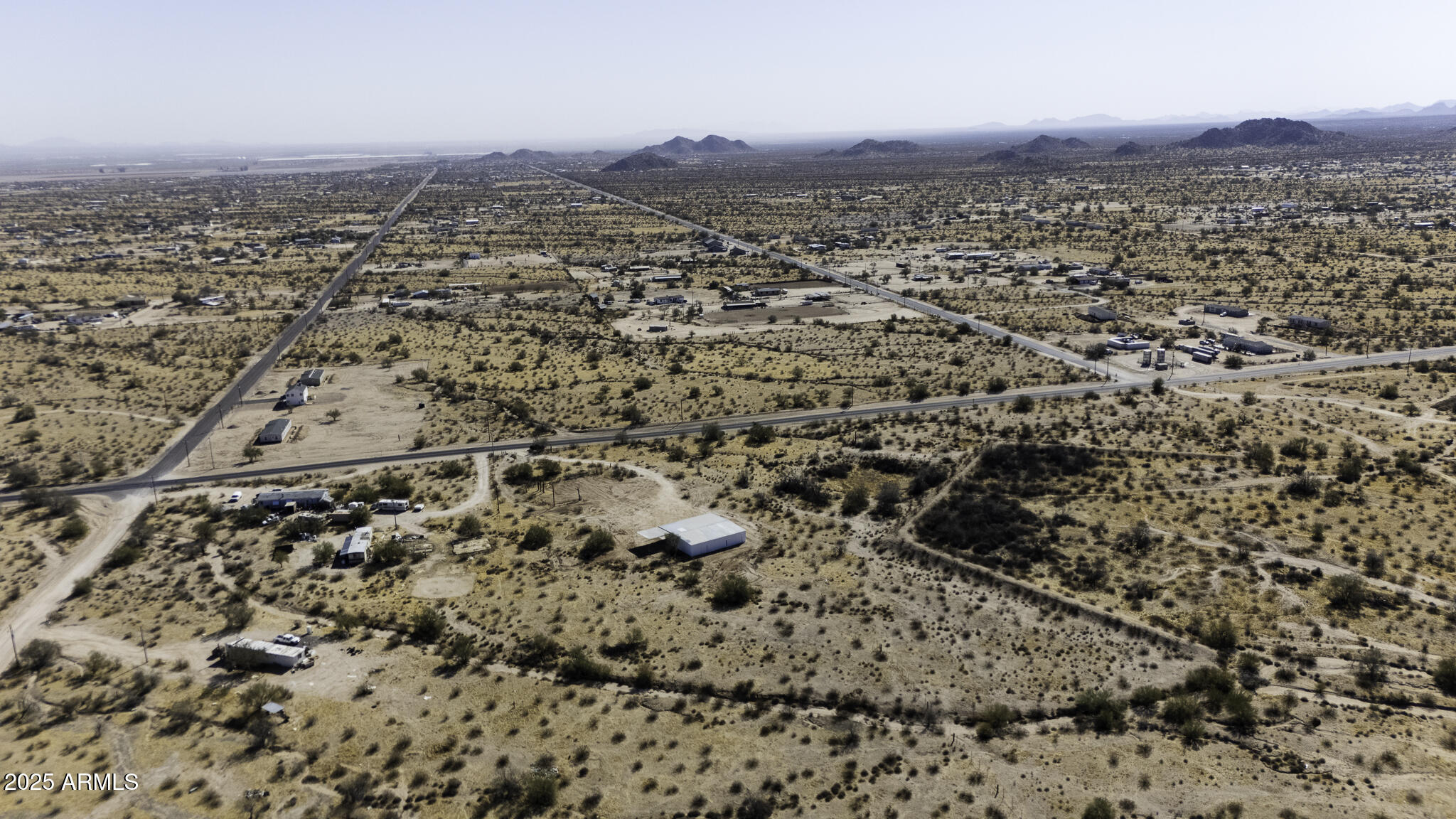 330 North Warren Road, Unit 50161001G Maricopa, AZ 85139 - Photo 32 of 39 an aerial view of house with yard and mountain view in back