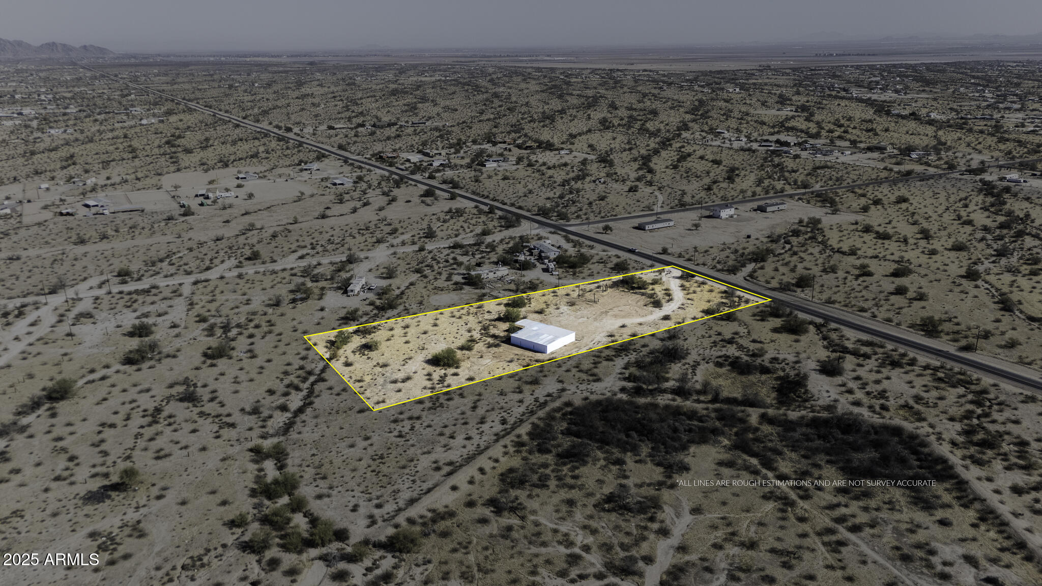 330 North Warren Road, Unit 50161001G Maricopa, AZ 85139 - Photo 33 of 39 a view of a dry field with trees