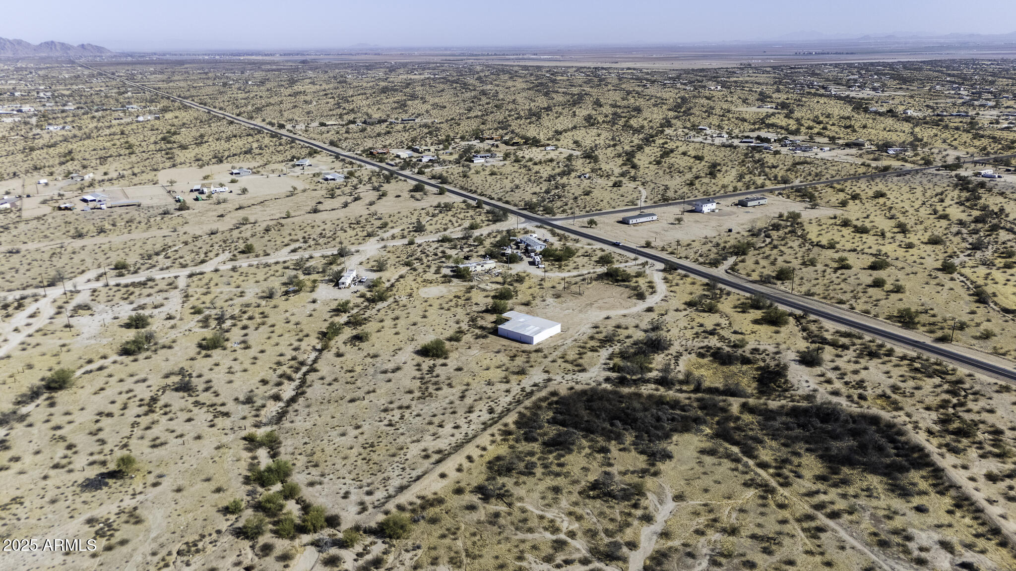 330 North Warren Road, Unit 50161001G Maricopa, AZ 85139 - Photo 34 of 39 an aerial view of a house with a yard