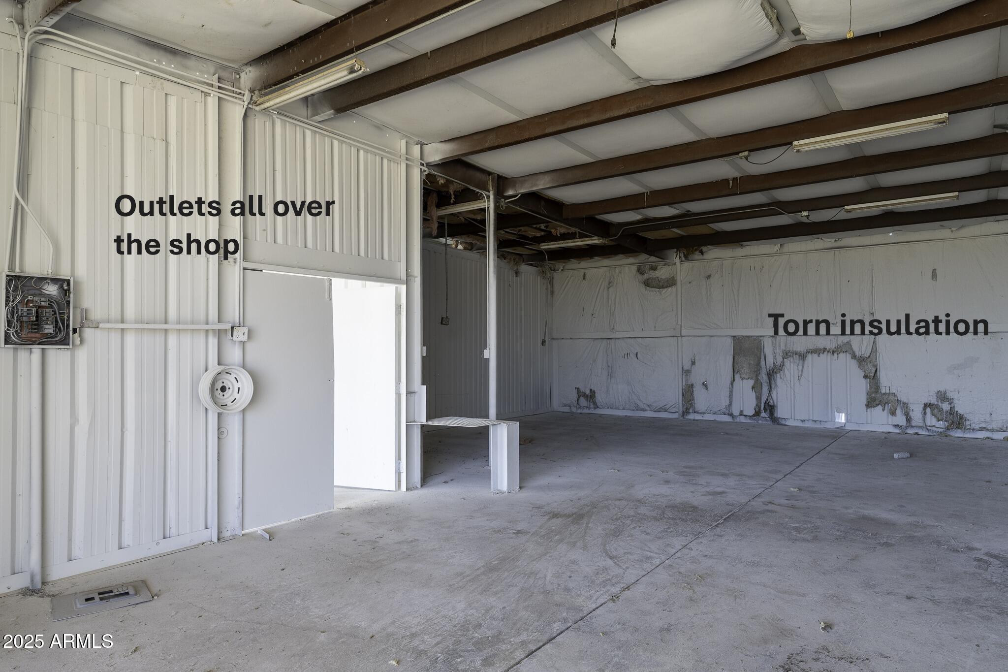 330 North Warren Road, Unit 50161001G Maricopa, AZ 85139 - Photo 6 of 39 a view of a room with wooden walls