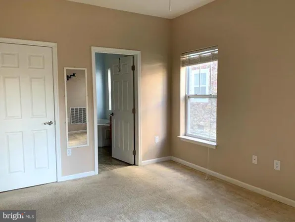 an empty room that has a window
