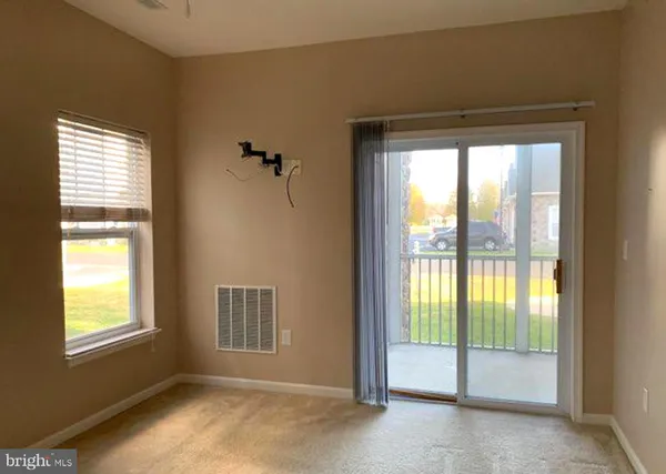 a view of an empty room and window