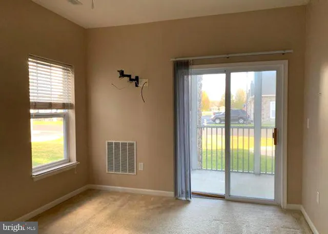 a view of an empty room and window