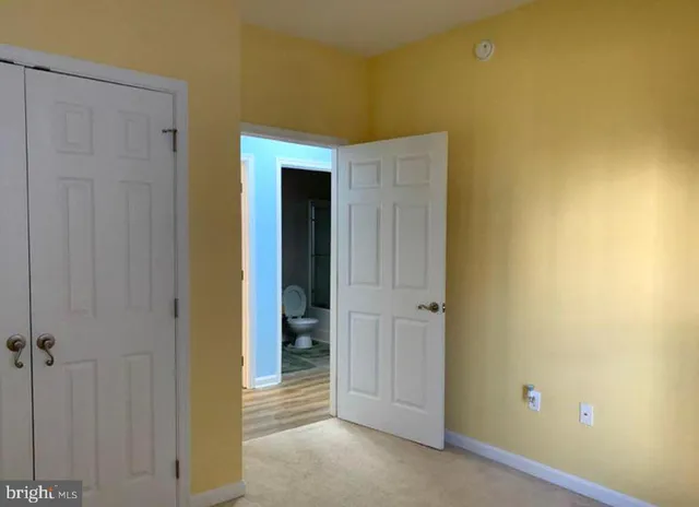 a view of hallway with closet area